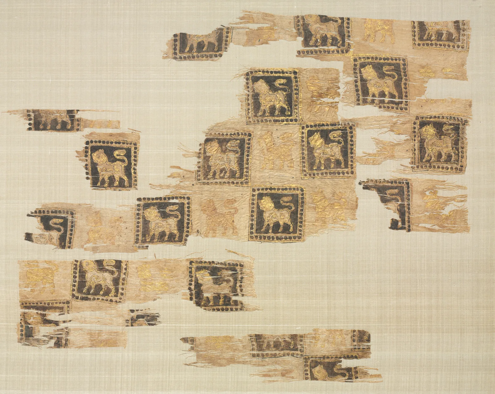 Fragment with gold leaf lions