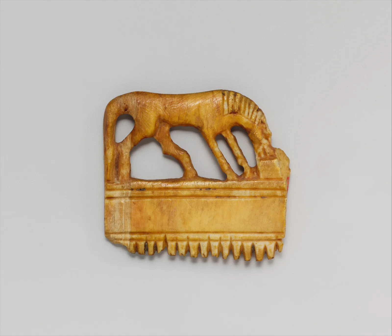Comb with a horse