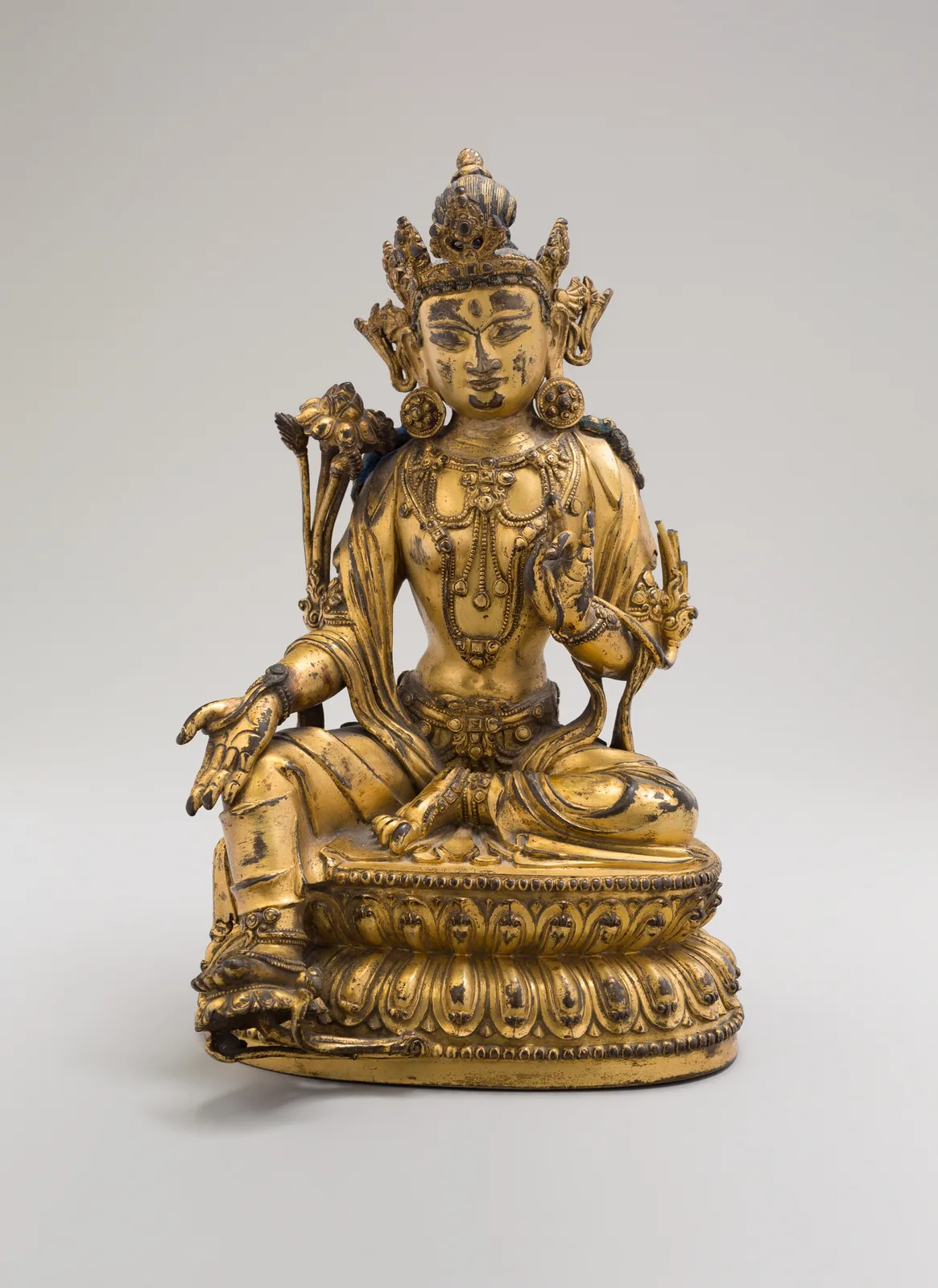 Green Tara, Seated in Pose of Royal Ease (Lalitasana), with Lotus Stalks on Right Shoulder and Hands in Gestures of Reasoning (Vitarkamudra) and Gift Conferring (Varadamudra)