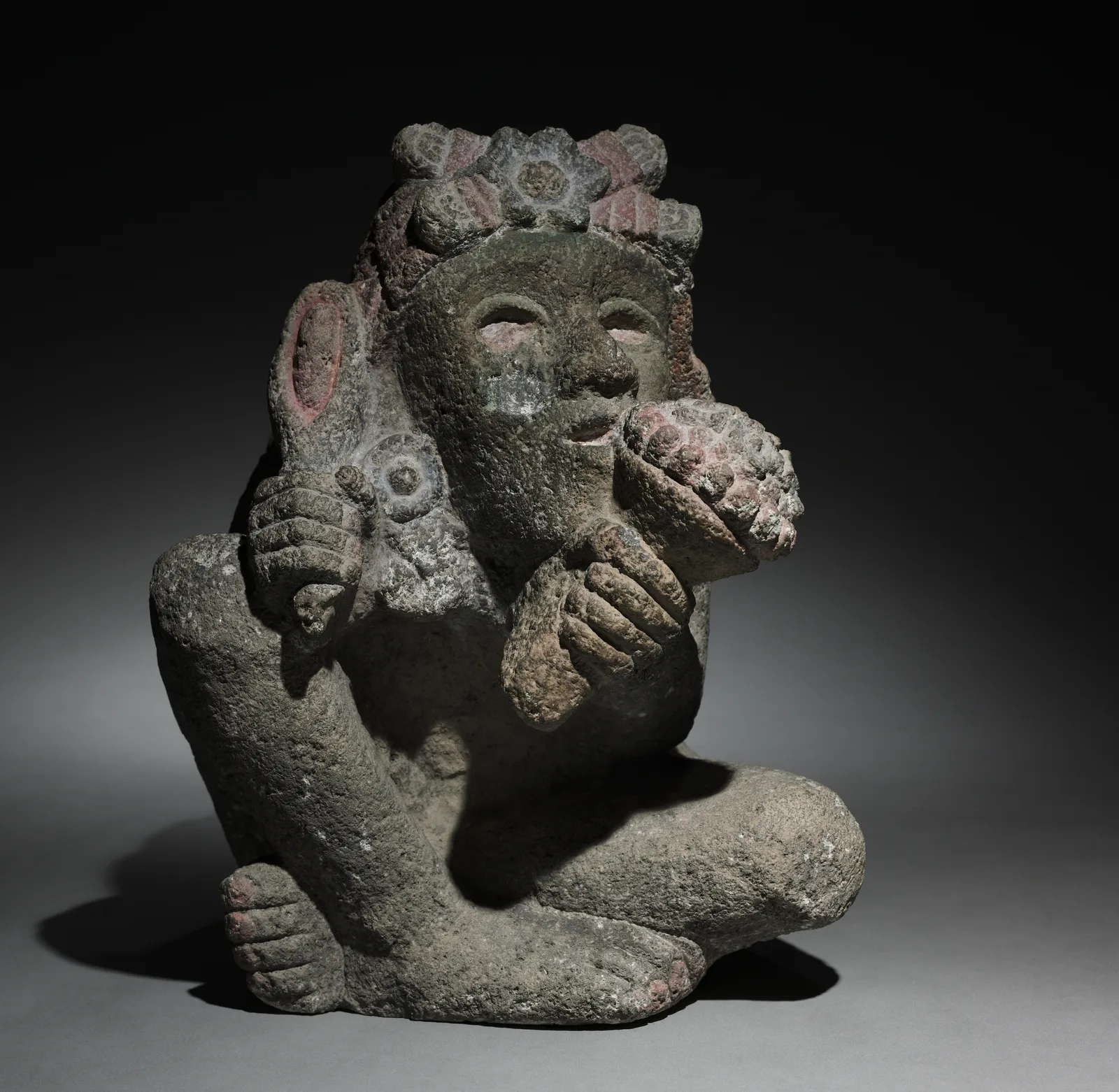 Seated Male Carrying Maize